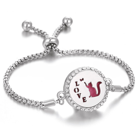 Stylish silver fragrance bracelet featuring a charming design of a cat touching hearts, perfect for cat lovers seeking a unique and aromatic accessory.